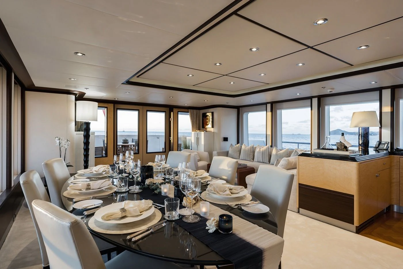 a large dining room with a large window aboard GLADIATOR Yacht for Sale