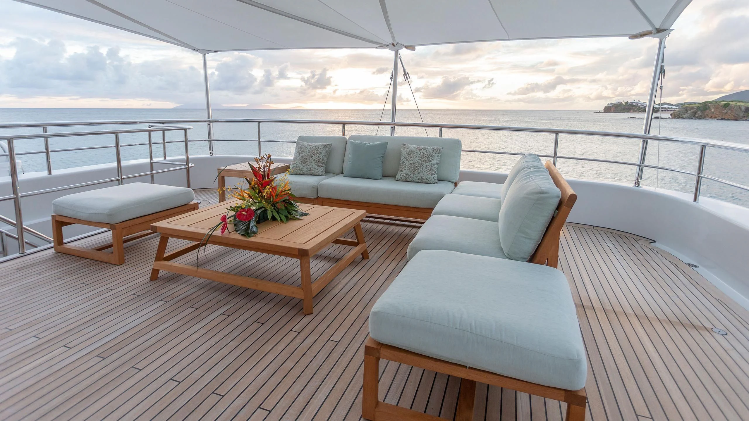a room with a couch and a table and a large body of water aboard GLADIATOR Yacht for Sale