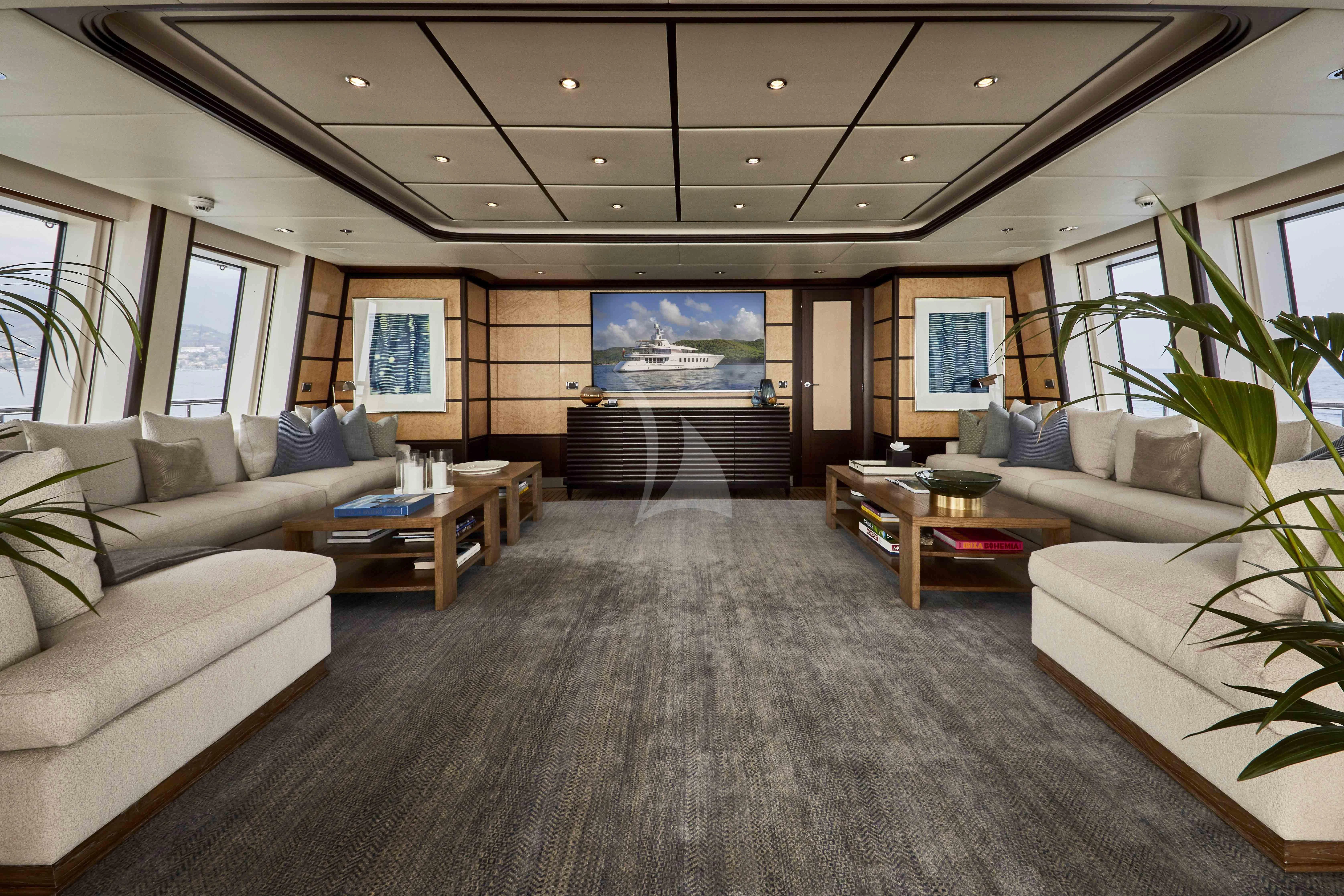 a living room with a couch and a table aboard GLADIATOR Yacht for Sale