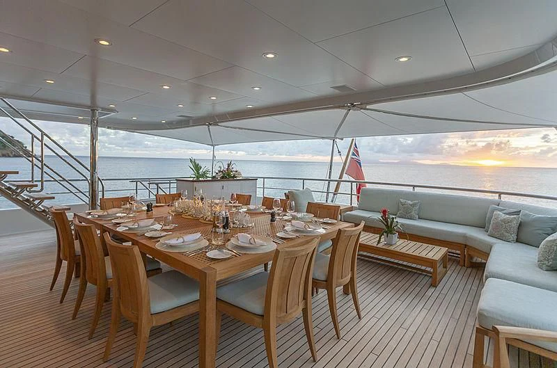 a table set for a dinner party aboard GLADIATOR Yacht for Sale