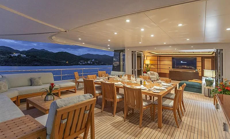 a room with a table and chairs aboard GLADIATOR Yacht for Sale