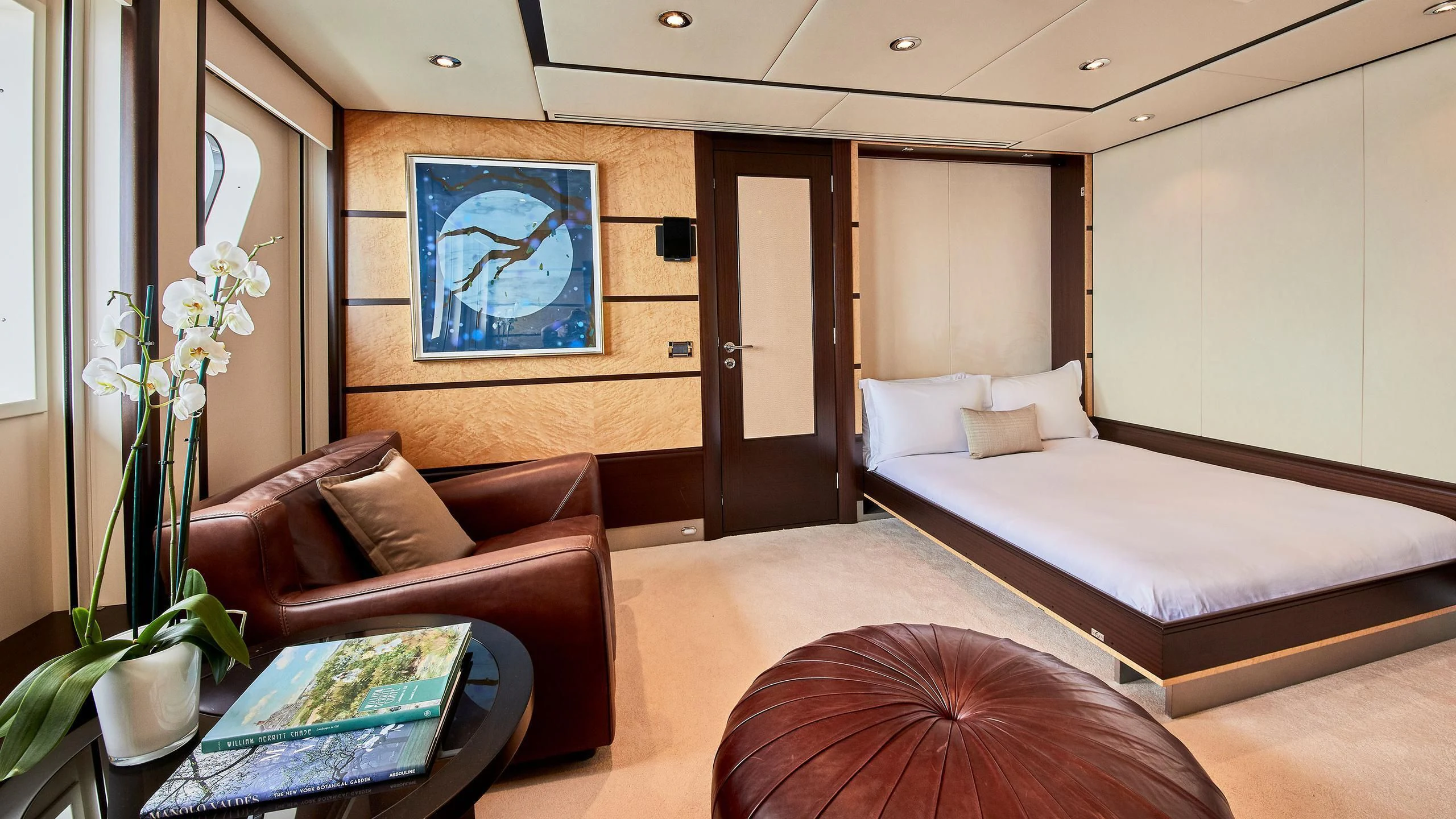 a room with a bed and a couch aboard GLADIATOR Yacht for Sale
