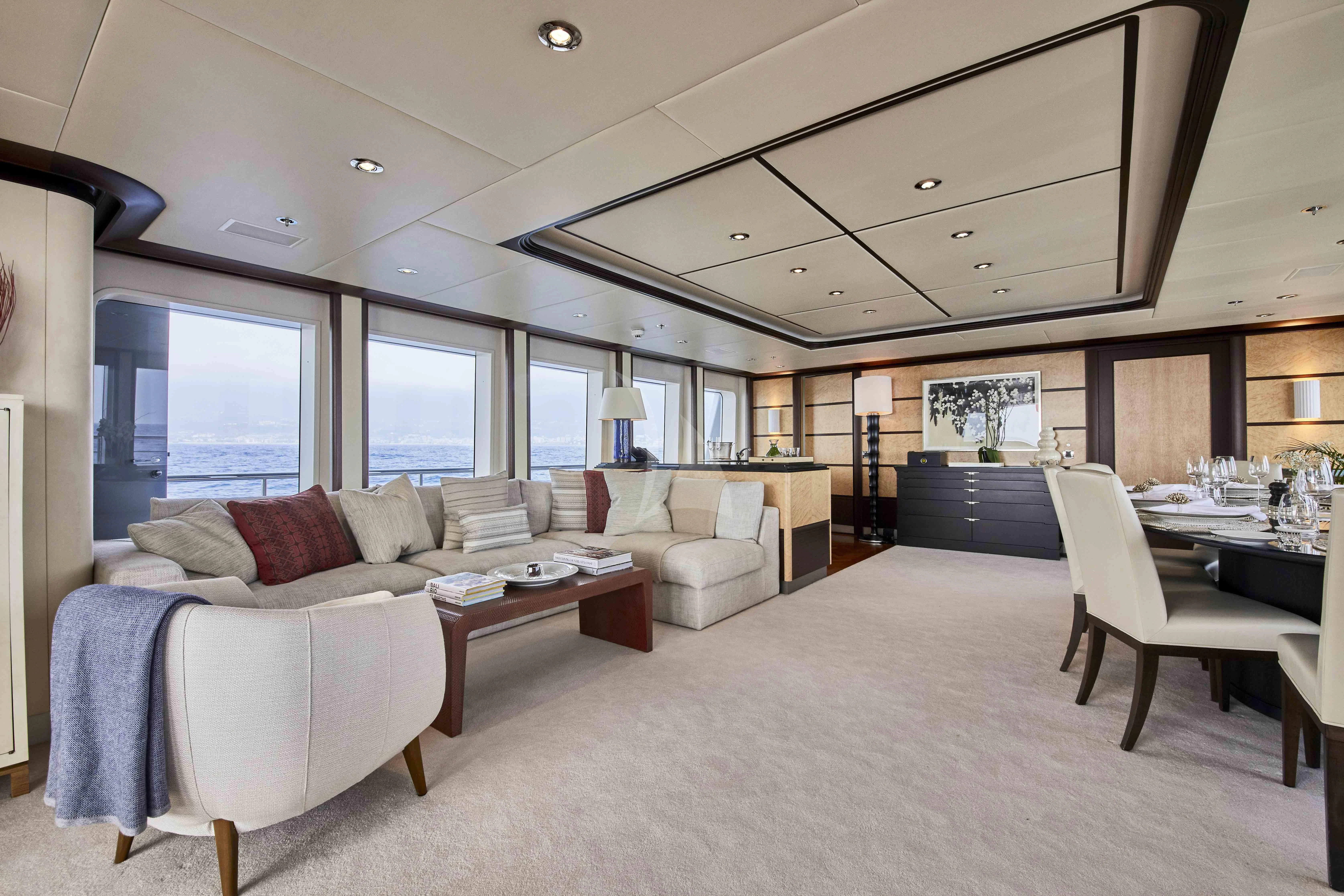 a large living room with a large bed and a couch aboard GLADIATOR Yacht for Sale