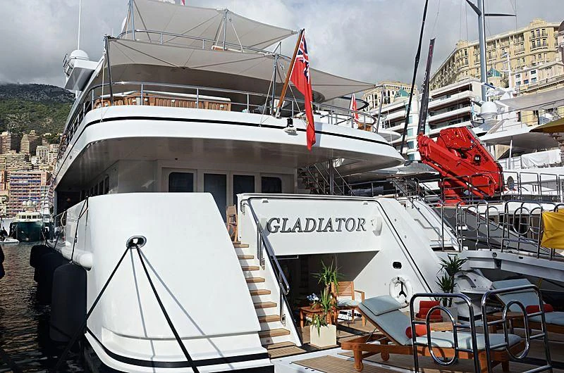 a large white boat docked aboard GLADIATOR Yacht for Sale