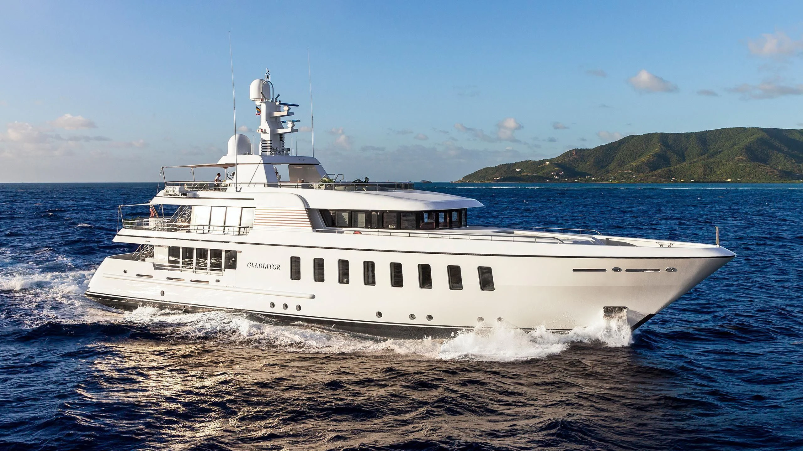 a white boat on the water aboard GLADIATOR Yacht for Sale