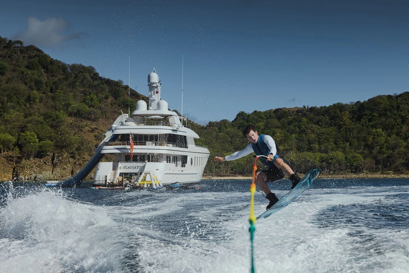 a man is water skiing aboard GLADIATOR Yacht for Sale