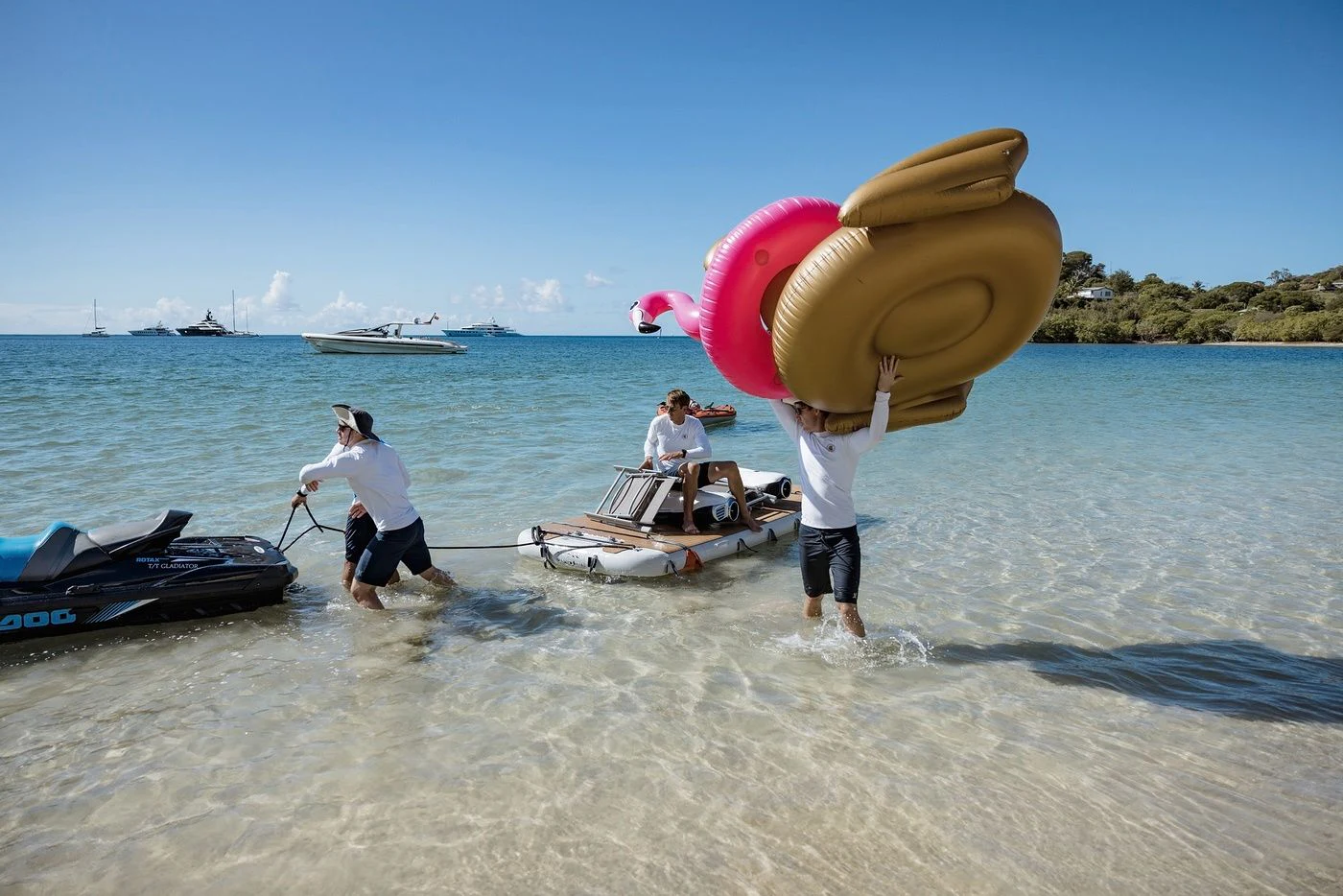 a man and a woman on a boat with a large inflatable piggy bank in the aboard GLADIATOR Yacht for Sale