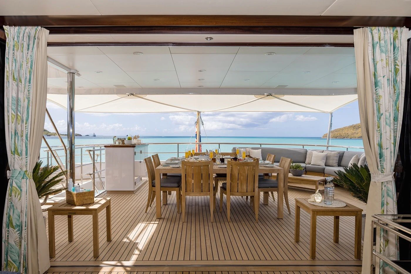 a room with a table and chairs aboard GLADIATOR Yacht for Sale