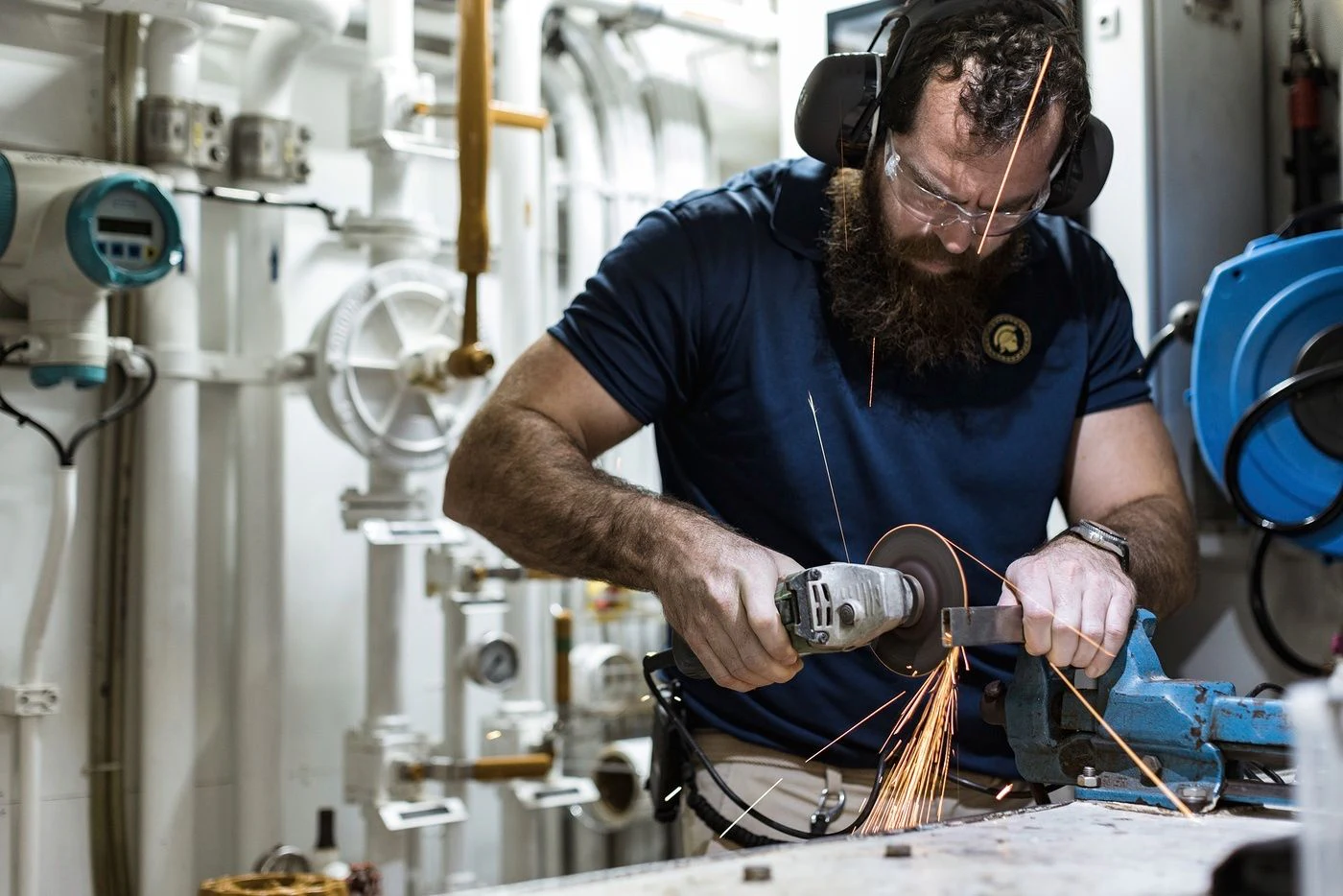 a man working on a machine aboard GLADIATOR Yacht for Sale