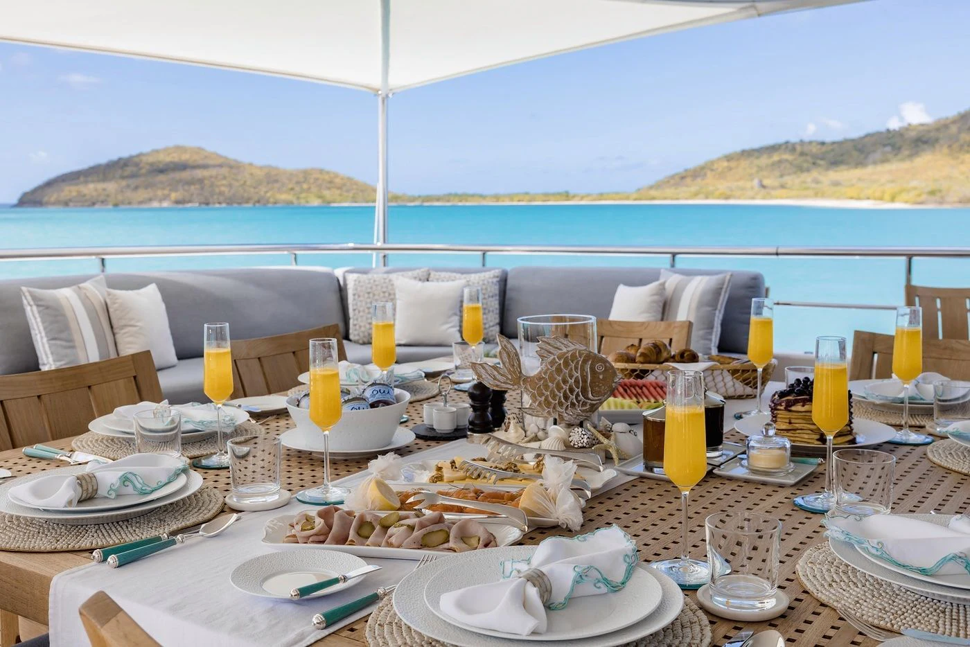 a table set with food and drinks aboard GLADIATOR Yacht for Sale