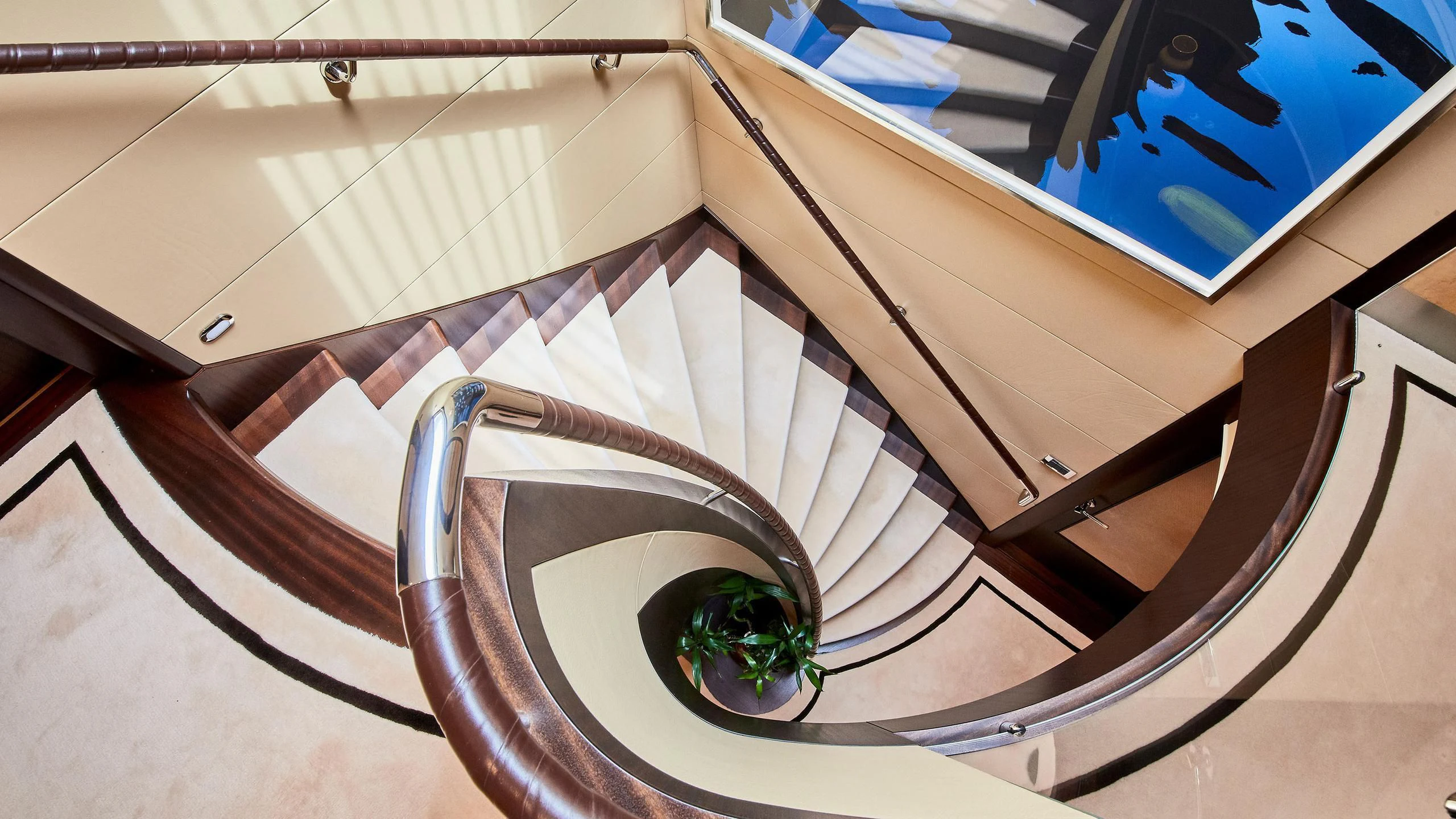 a staircase with a glass railing aboard GLADIATOR Yacht for Sale