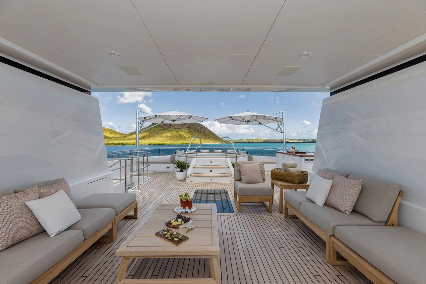 a living room with a large balcony aboard GLADIATOR Yacht for Sale
