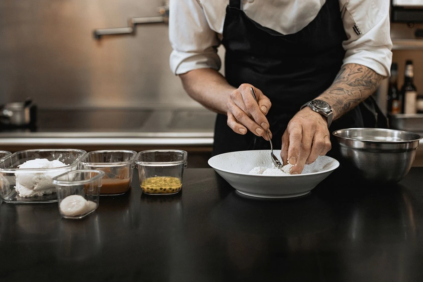 a chef preparing food in a kitchen aboard GLADIATOR Yacht for Sale