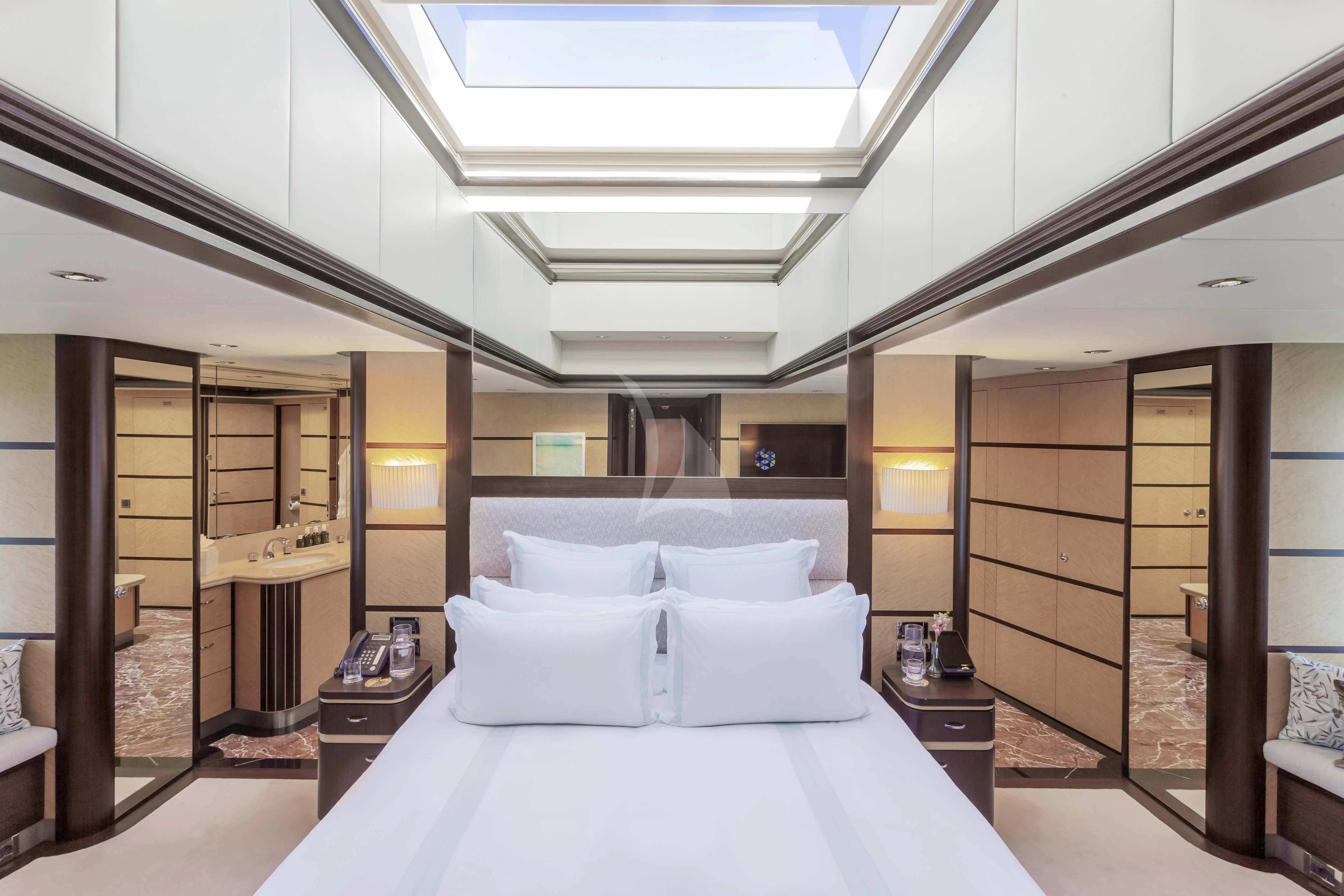 a large bed in a room aboard GLADIATOR Yacht for Sale