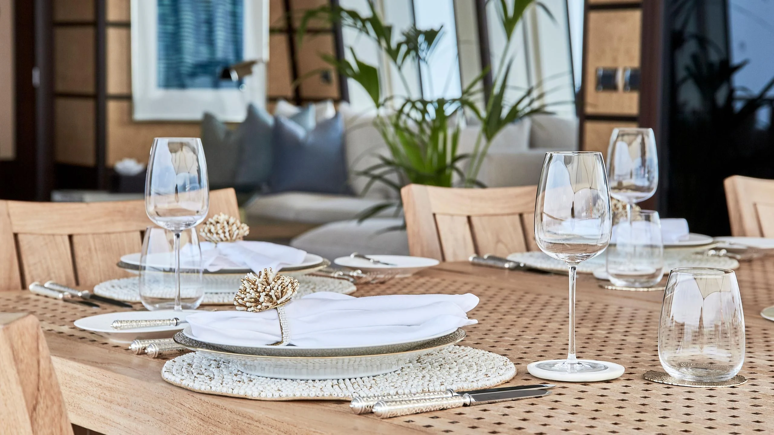 a table with plates and glasses on it aboard GLADIATOR Yacht for Sale