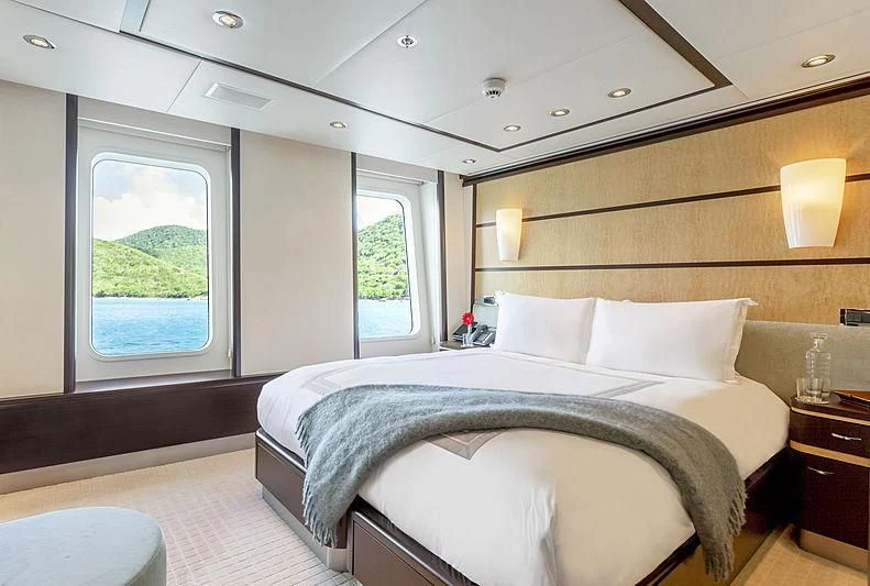 a bedroom with a large bed aboard GLADIATOR Yacht for Sale