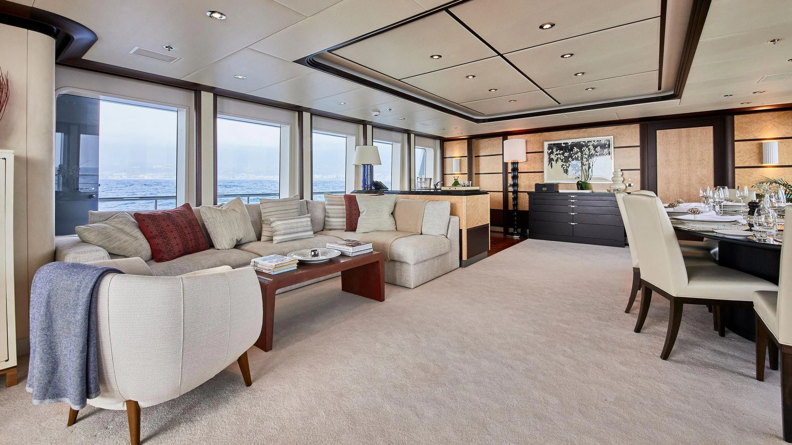 a living room with a couch and a table aboard GLADIATOR Yacht for Sale