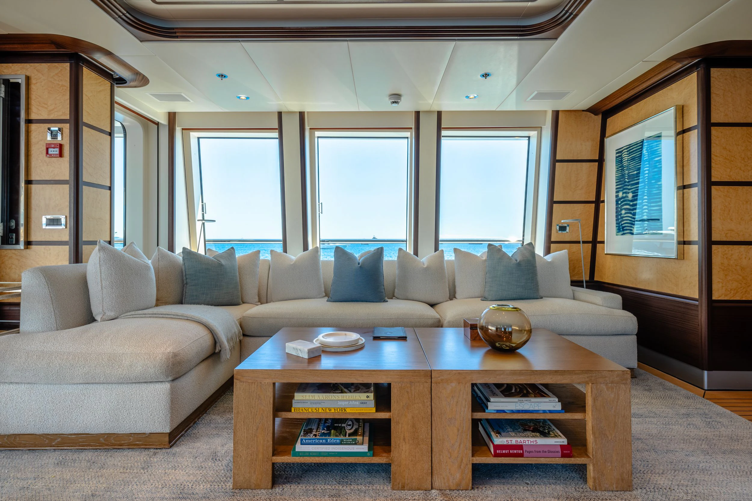 a living room with a couch and a coffee table aboard GLADIATOR Yacht for Sale