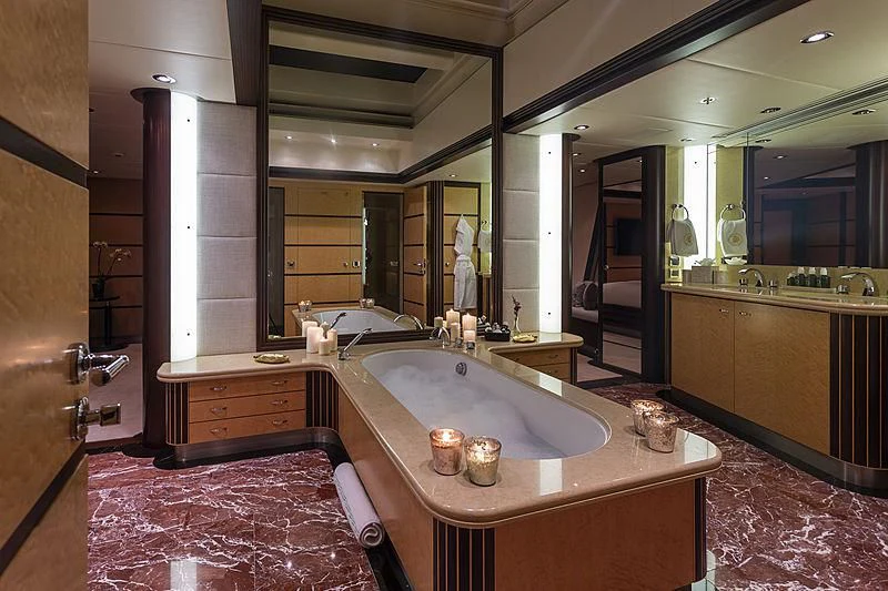 a large bathroom with a large round sink aboard GLADIATOR Yacht for Sale