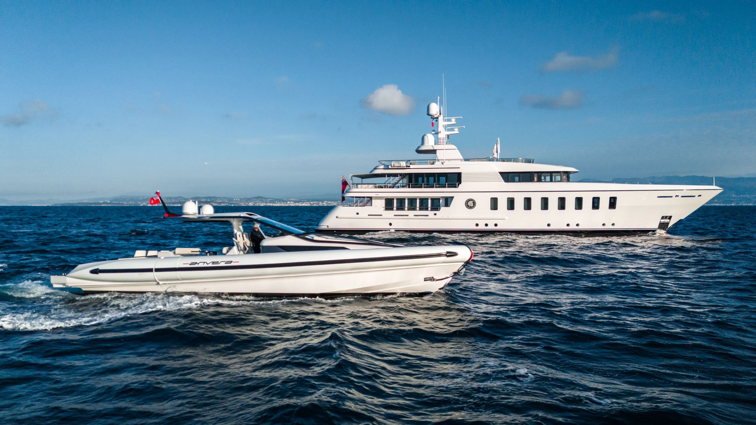 a white boat on the water aboard GLADIATOR Yacht for Sale