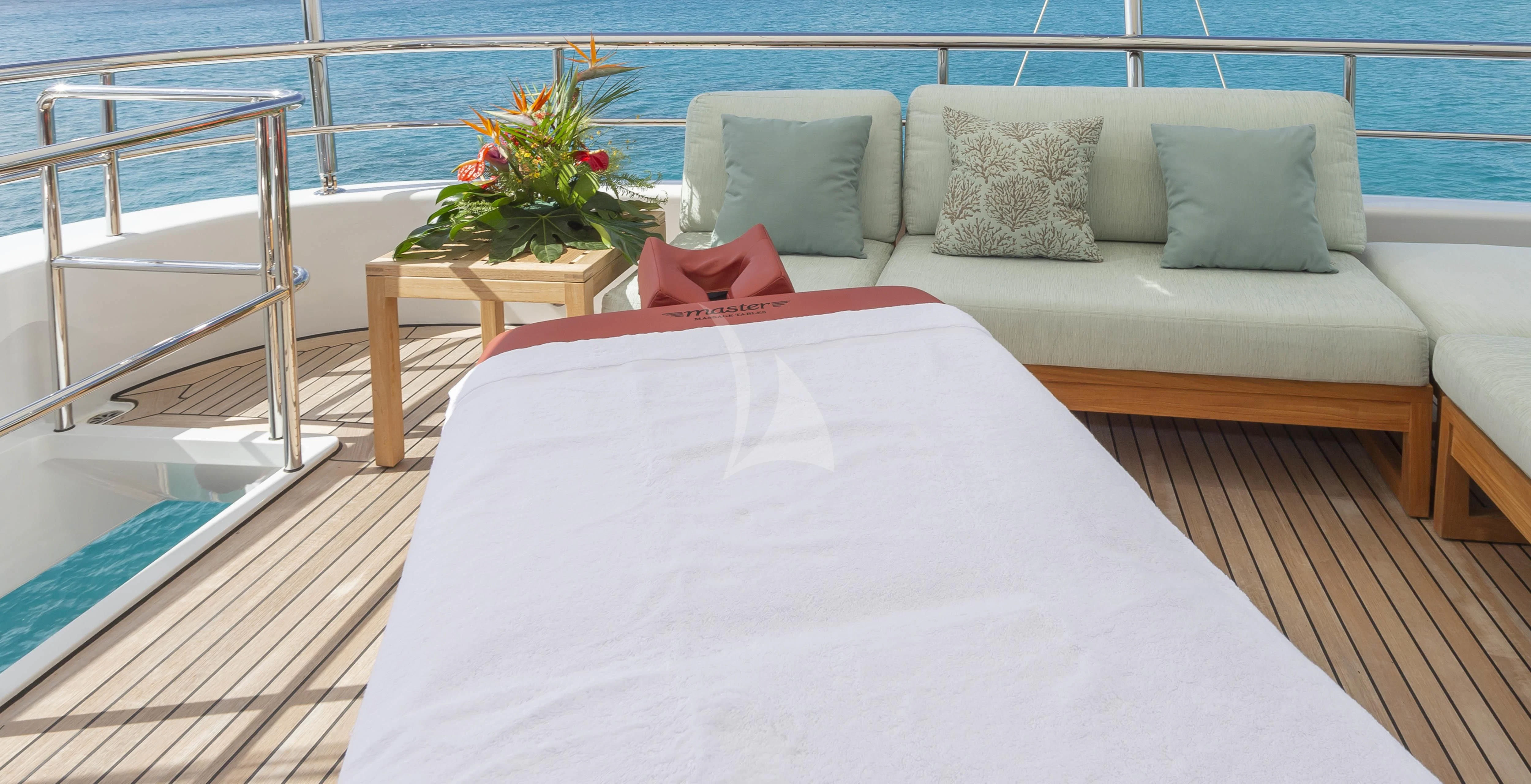 a bed on a balcony aboard GLADIATOR Yacht for Sale