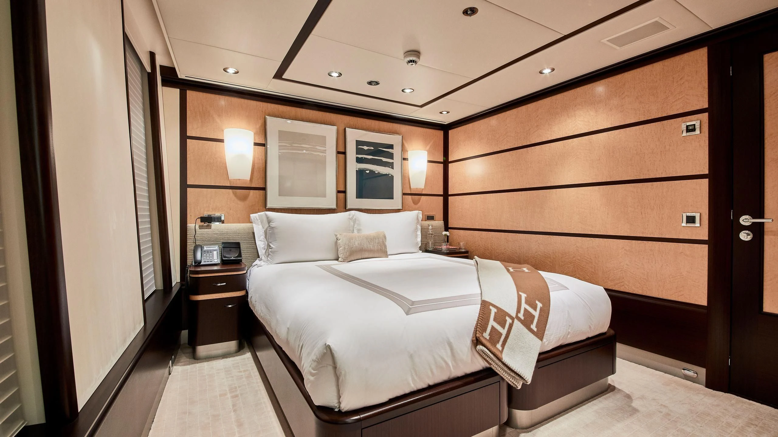 a room with a bed and a desk aboard GLADIATOR Yacht for Sale