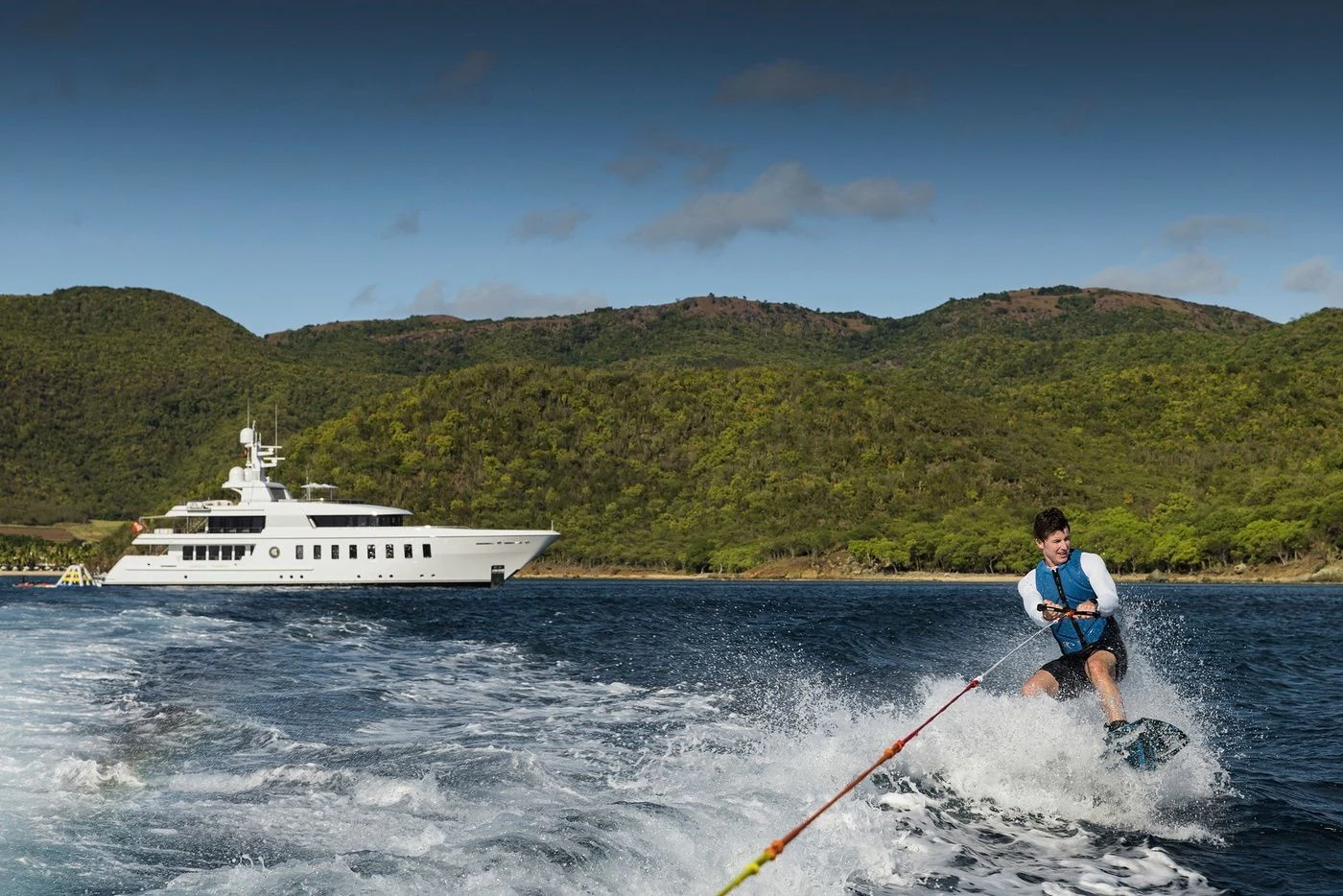 a man water skiing aboard GLADIATOR Yacht for Sale