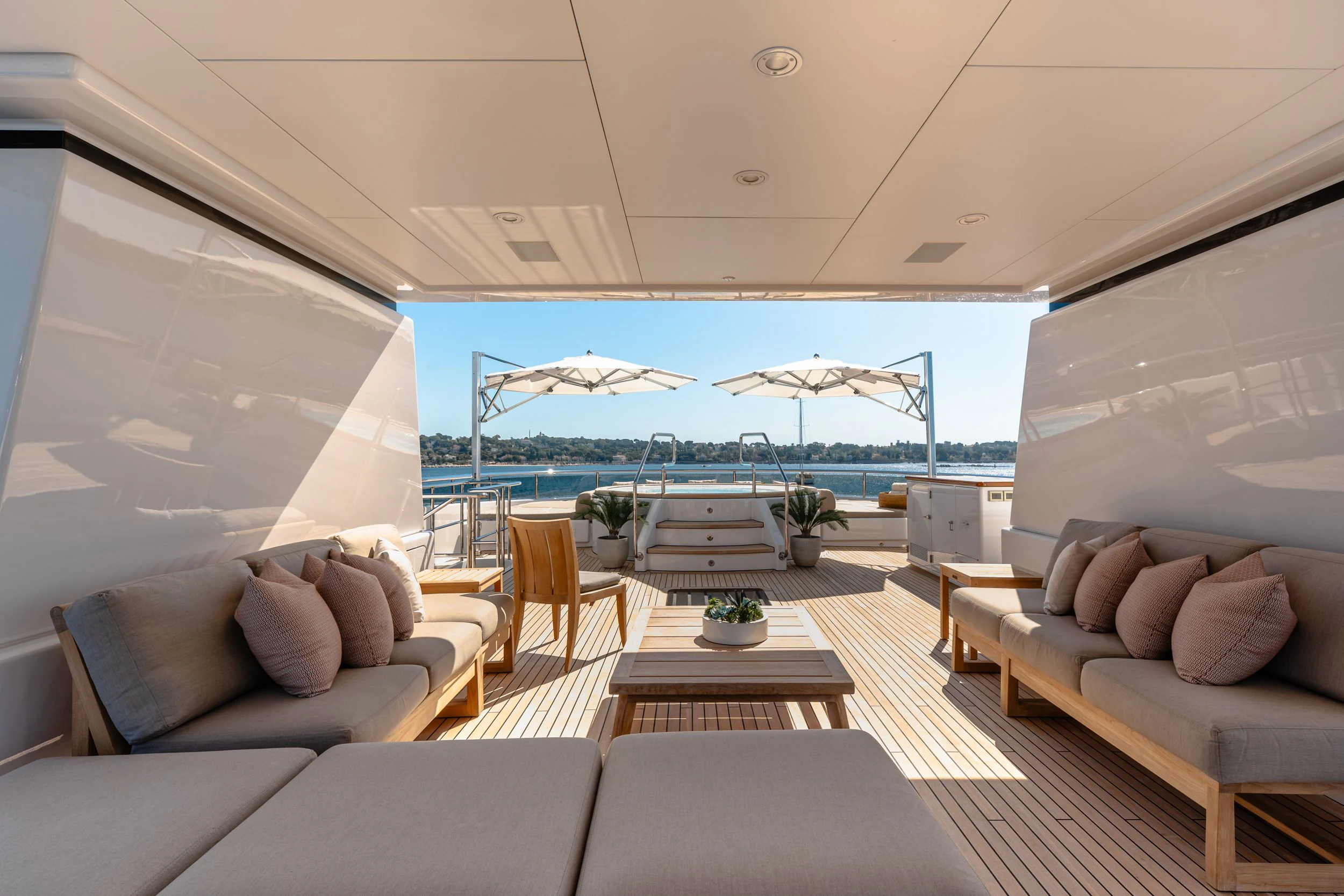a living room with a large patio aboard GLADIATOR Yacht for Sale