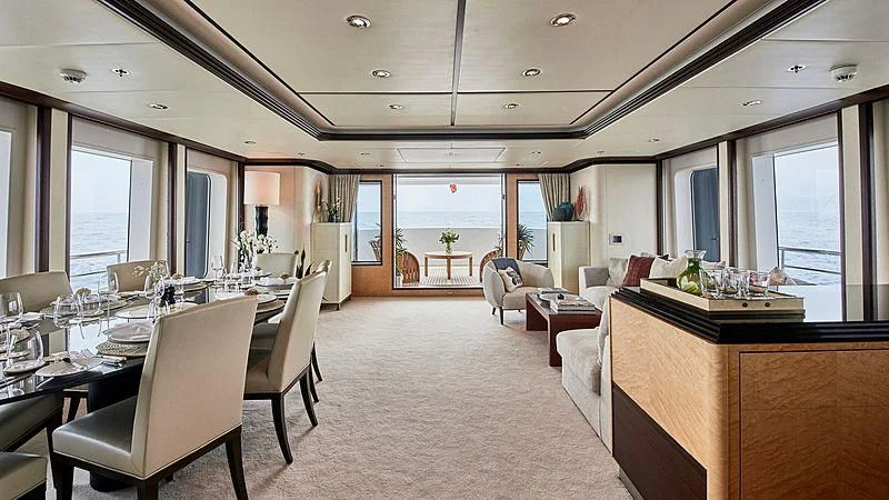 a large room with a large table and chairs aboard GLADIATOR Yacht for Sale