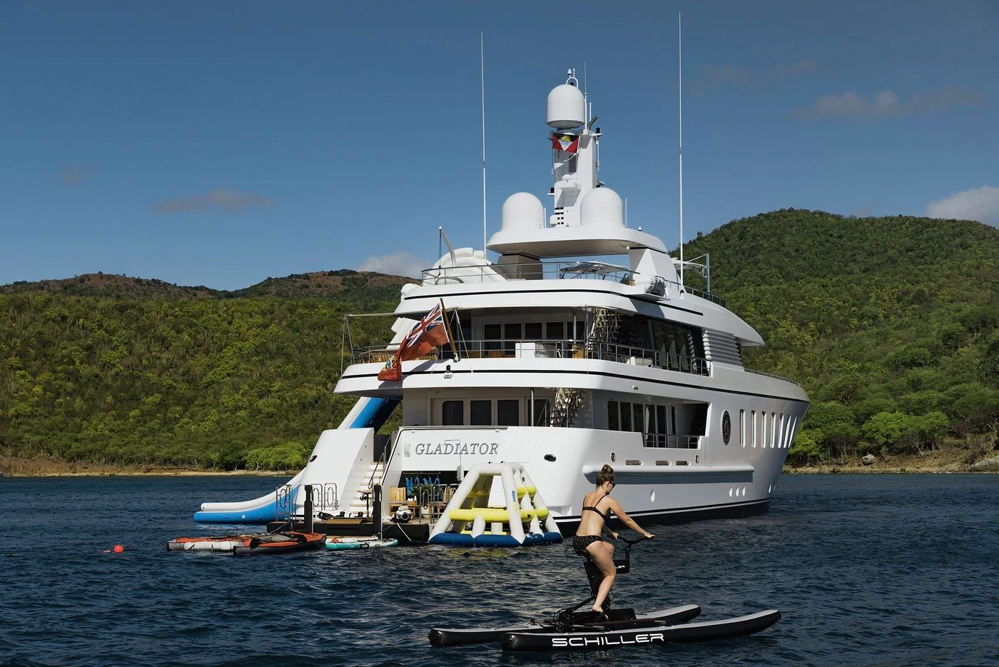 a person standing on a boat in the water aboard GLADIATOR Yacht for Sale
