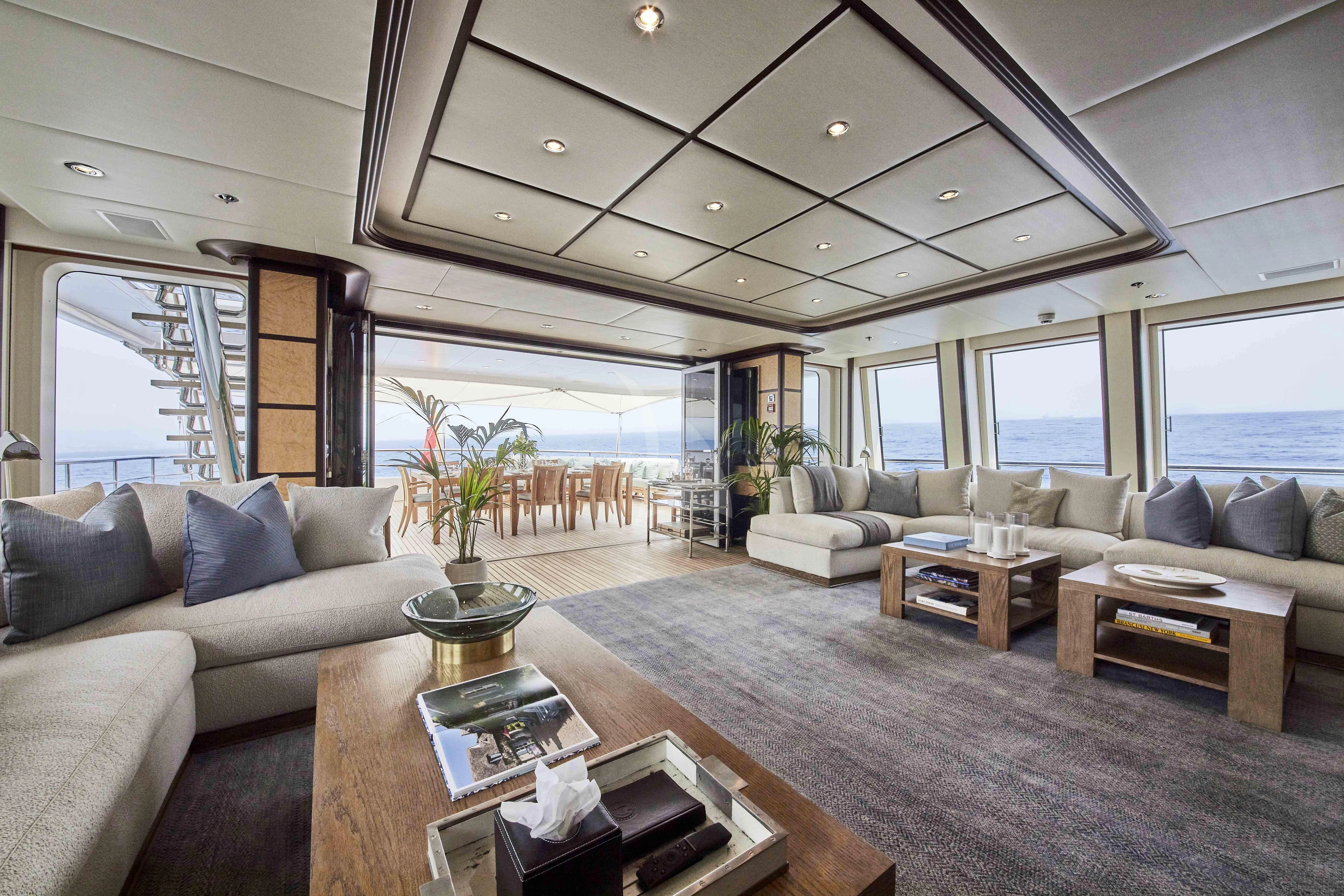 a living room with a large window aboard GLADIATOR Yacht for Sale