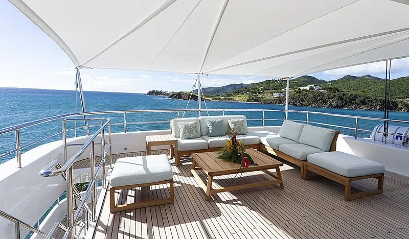 a deck with a large body of water and a large blue sky aboard GLADIATOR Yacht for Sale