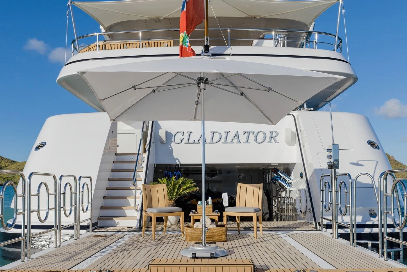 a large white boat with chairs around it aboard GLADIATOR Yacht for Sale