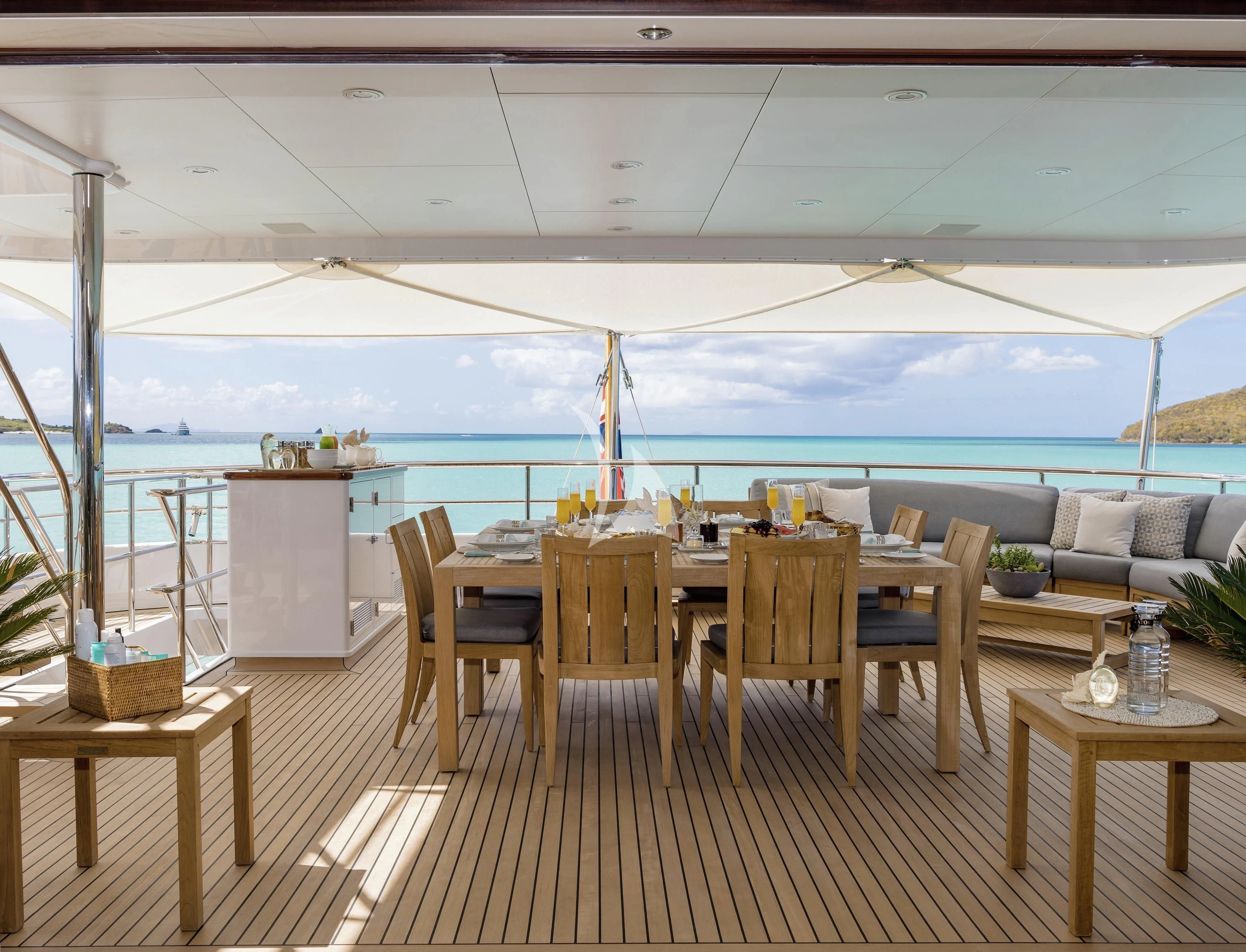a room with a table and chairs aboard GLADIATOR Yacht for Sale