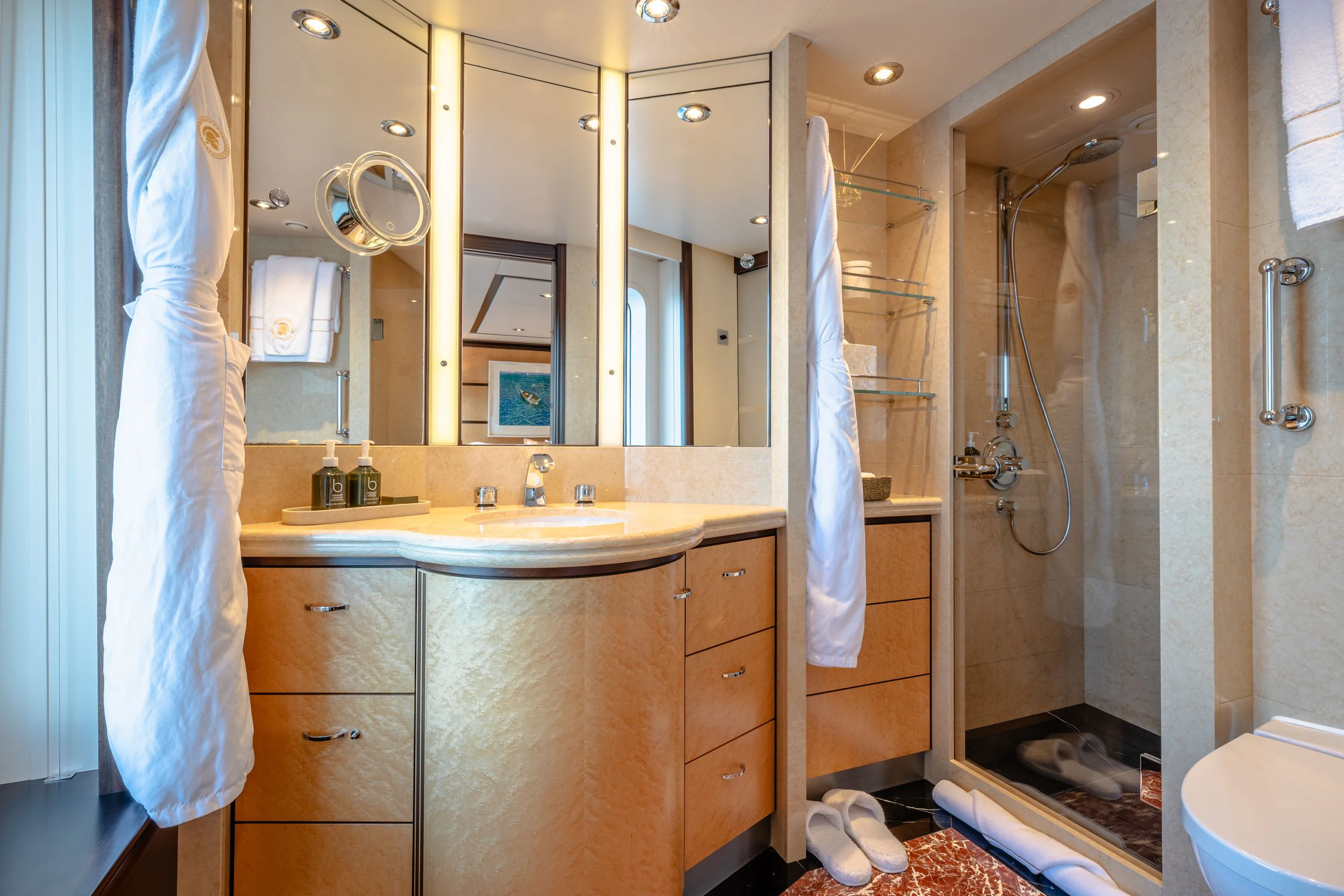a bathroom with a shower and sink aboard GLADIATOR Yacht for Sale