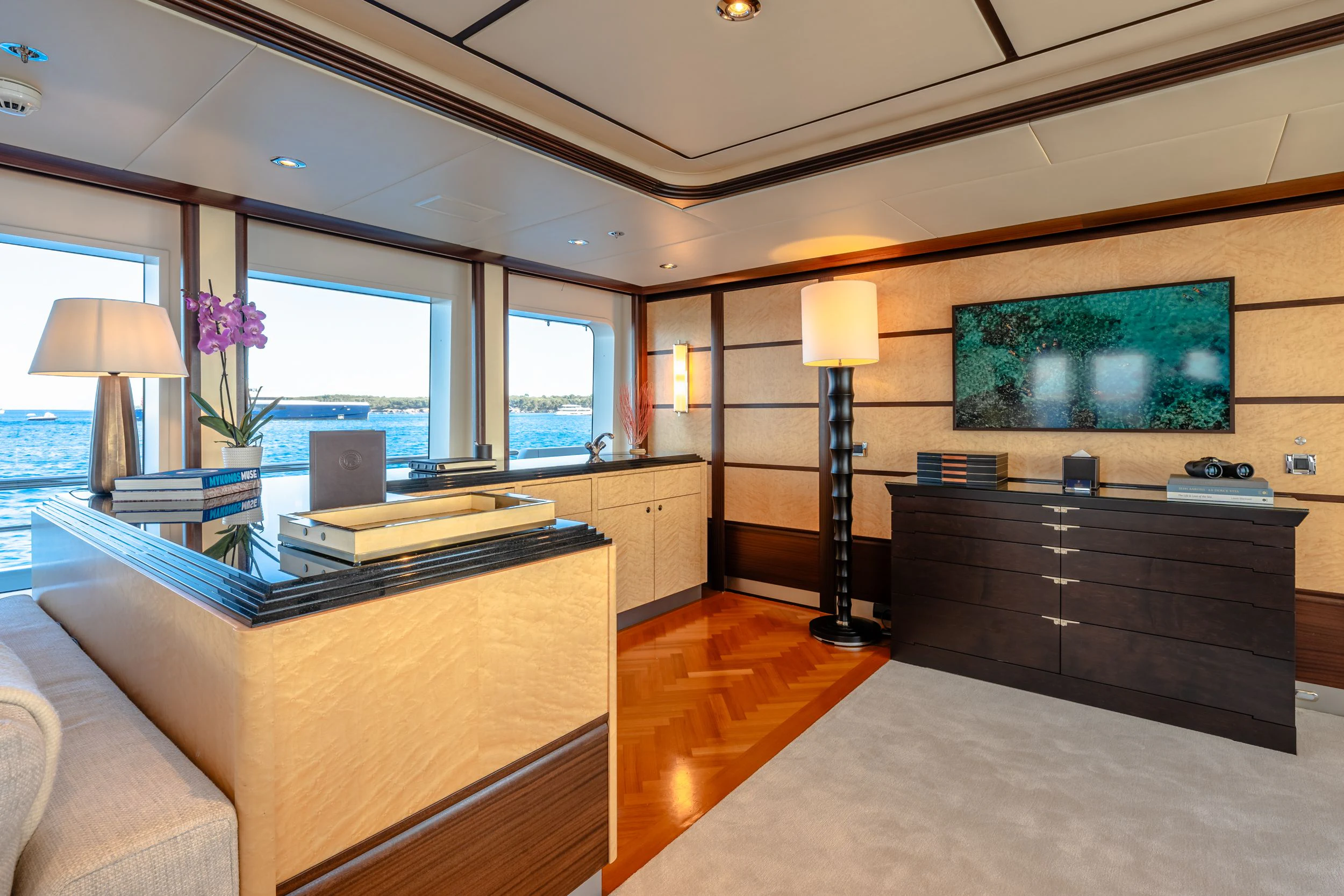 a room with a tv and a couch aboard GLADIATOR Yacht for Sale