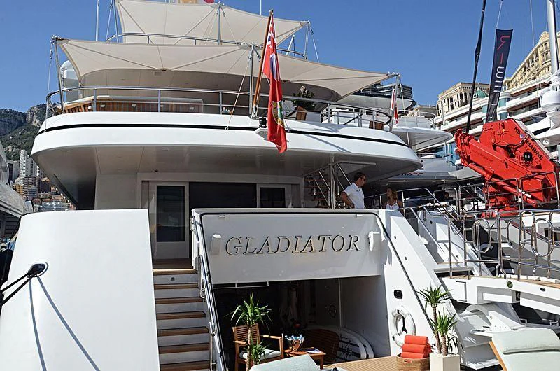 a boat docked at a pier aboard GLADIATOR Yacht for Sale