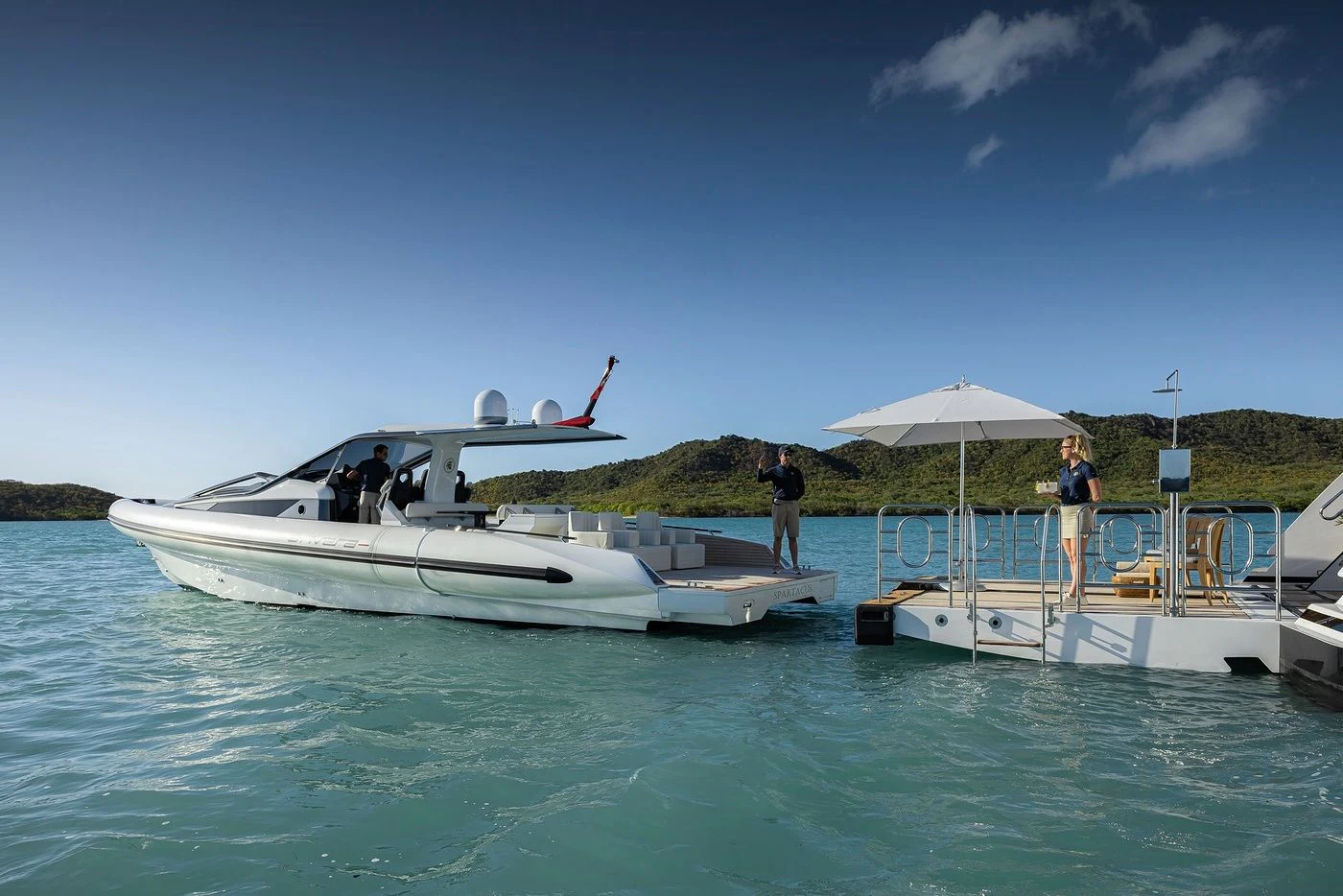 a couple of boats are parked in the water aboard GLADIATOR Yacht for Sale