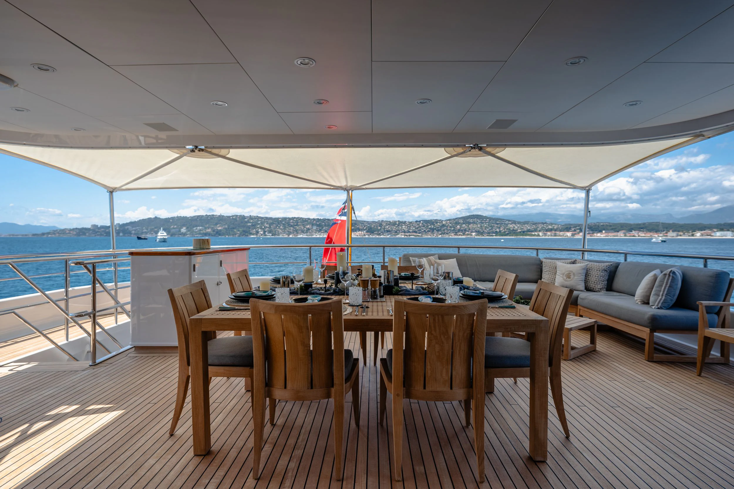 a table and chairs on a deck aboard GLADIATOR Yacht for Sale
