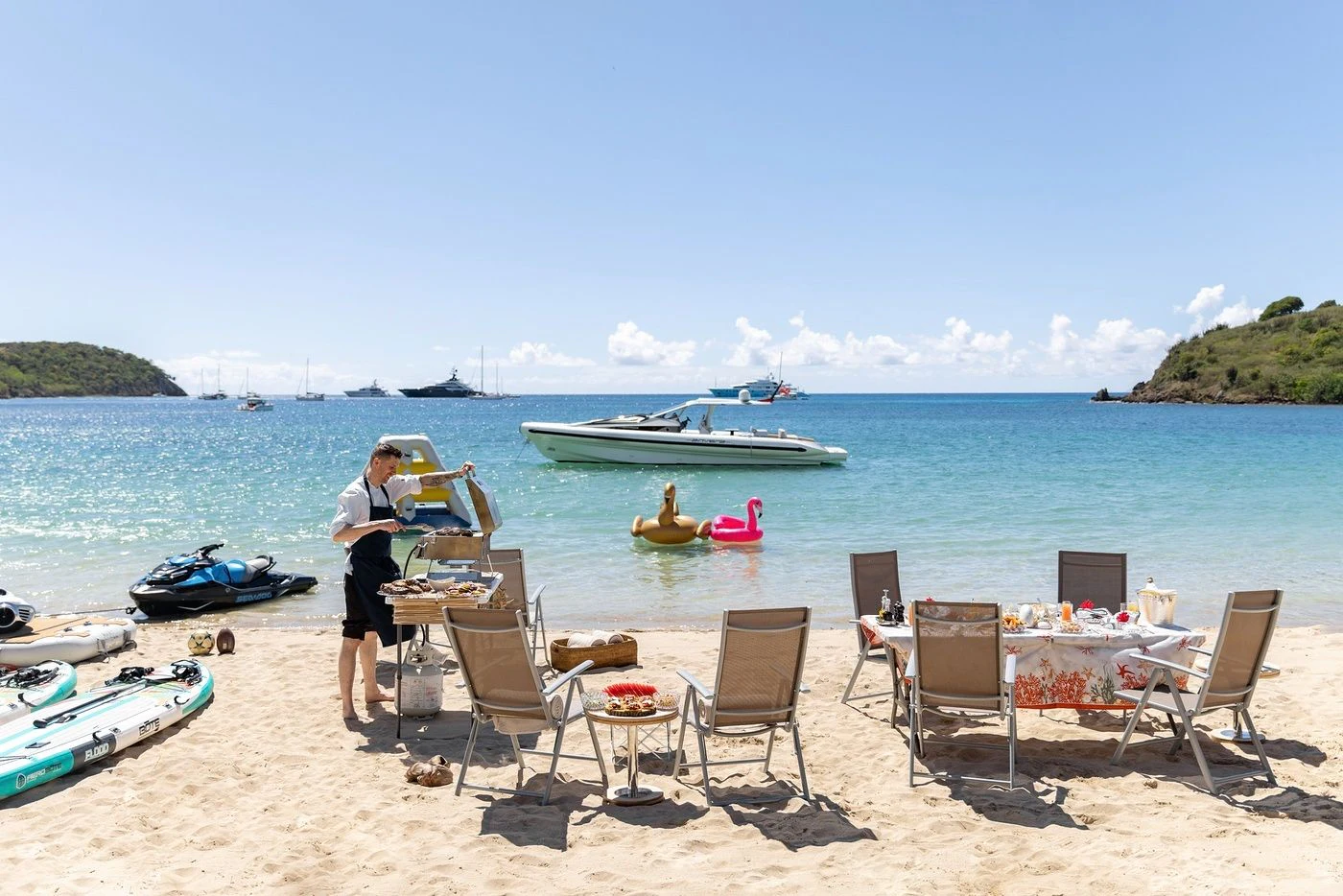 a couple of people on a beach aboard GLADIATOR Yacht for Sale