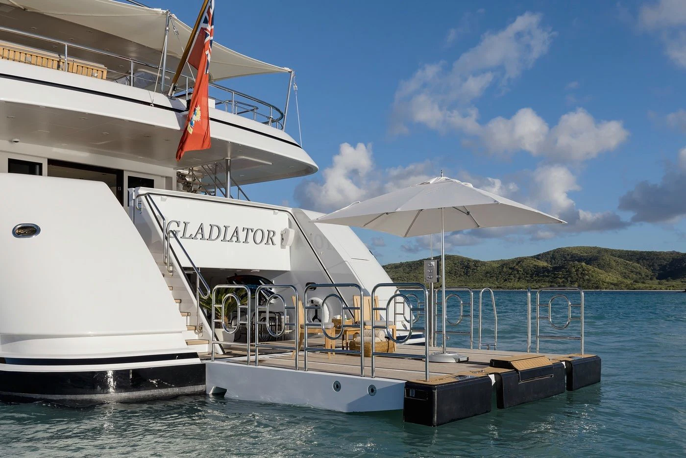 a boat docked at a pier aboard GLADIATOR Yacht for Sale