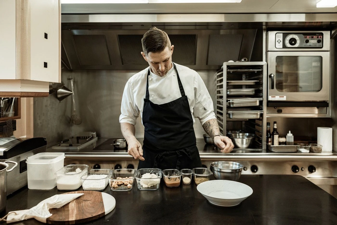 a chef in a kitchen aboard GLADIATOR Yacht for Sale