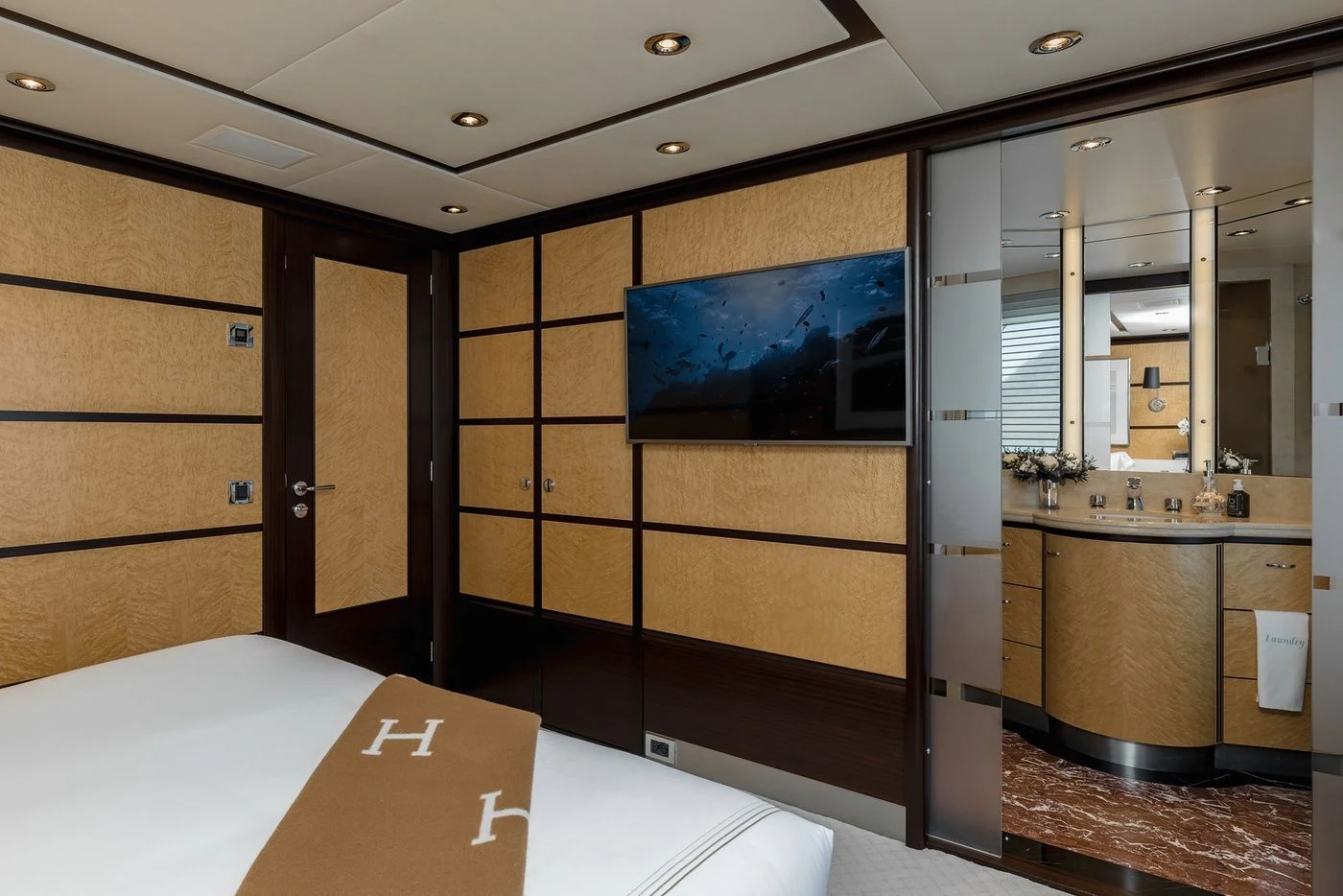 a bathroom with a large mirror aboard GLADIATOR Yacht for Sale