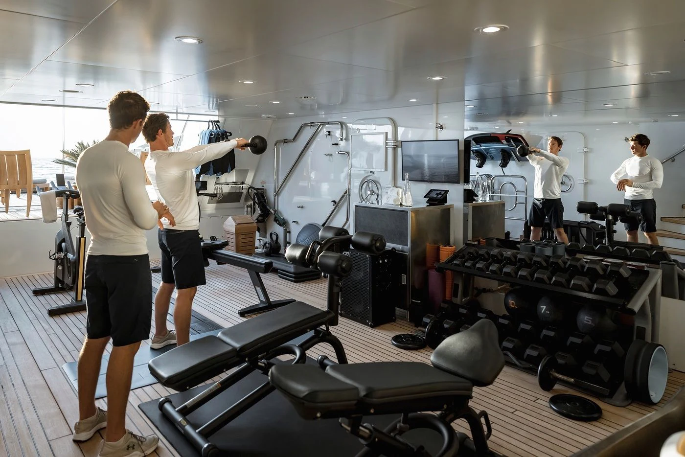 a group of people in a gym aboard GLADIATOR Yacht for Sale