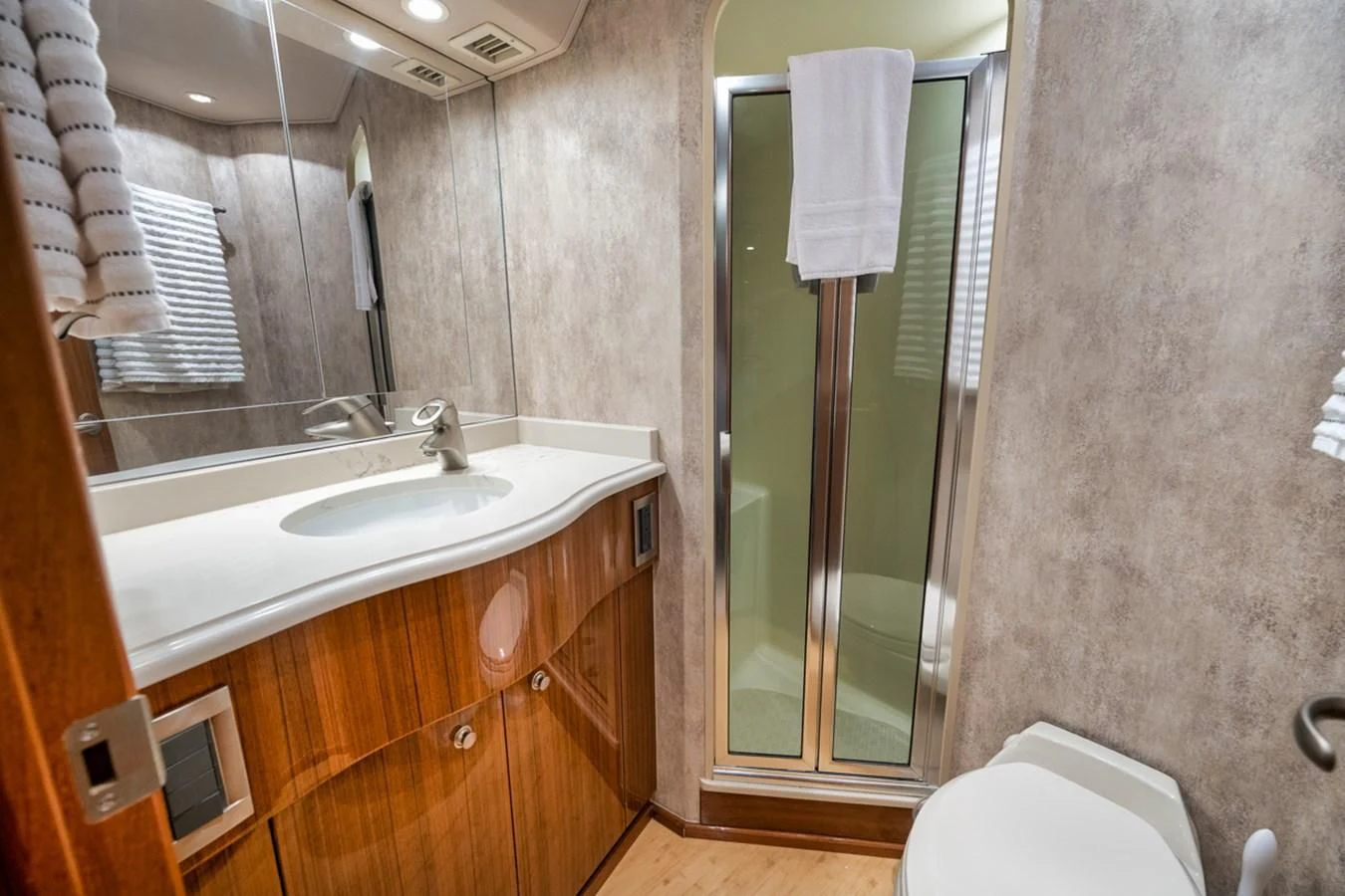 a bathroom with a glass shower door aboard 68 VIKING Yacht for Sale