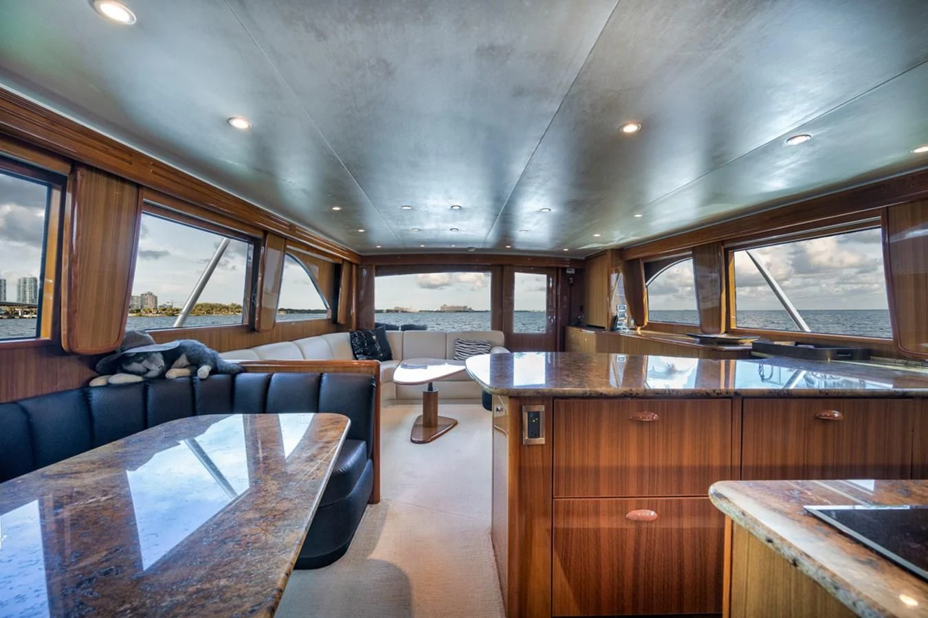 a large living room with wood cabinets aboard 68 VIKING Yacht for Sale