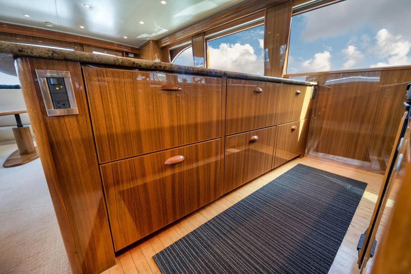 a room with wooden cabinets aboard 68 VIKING Yacht for Sale