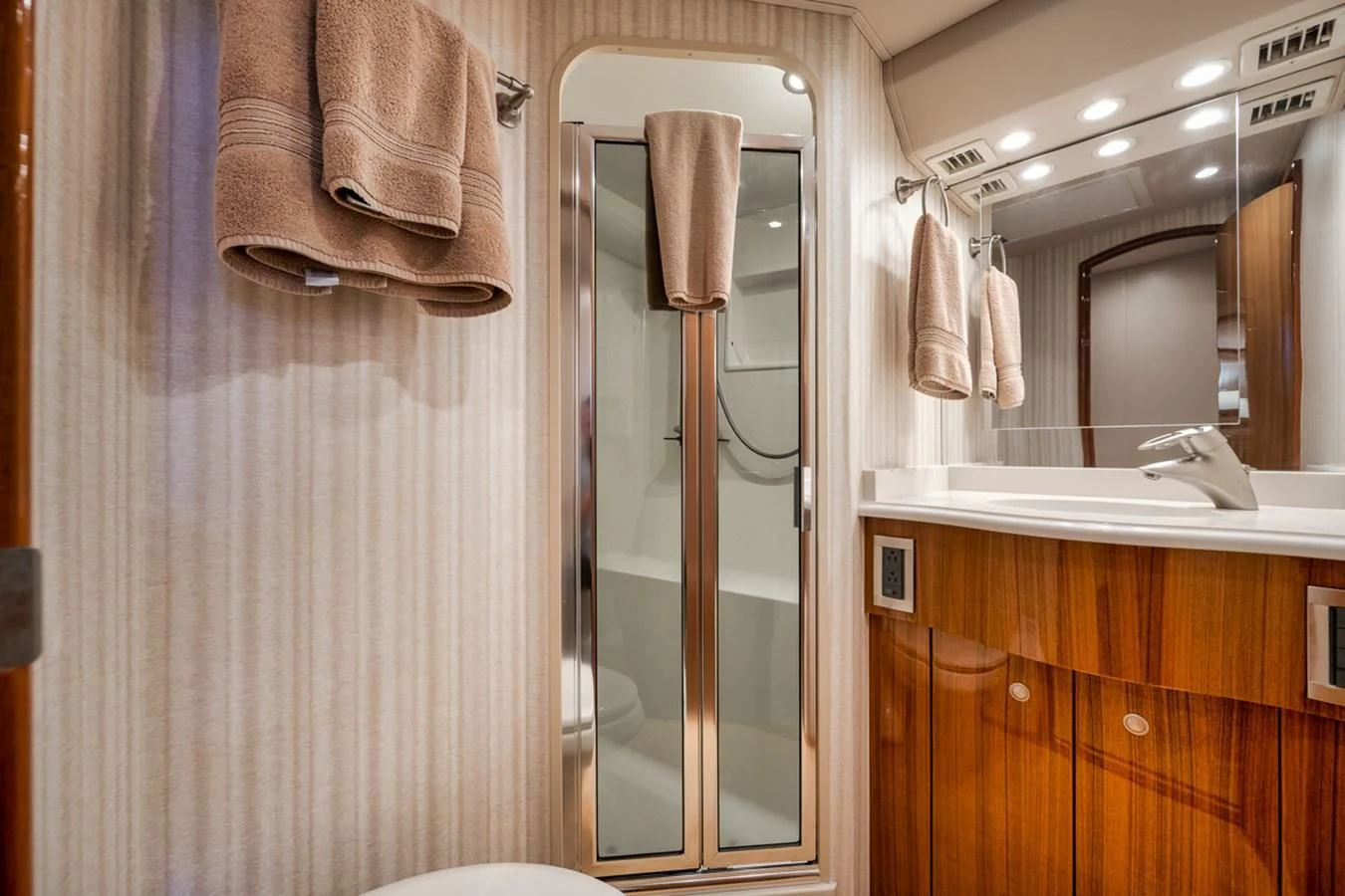 a bathroom with a sink and towels aboard 68 VIKING Yacht for Sale