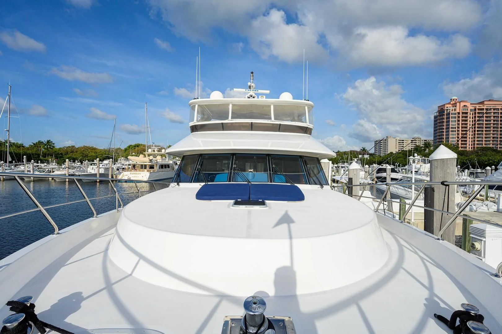a white boat in a harbor aboard BARNSTAR Yacht for Sale