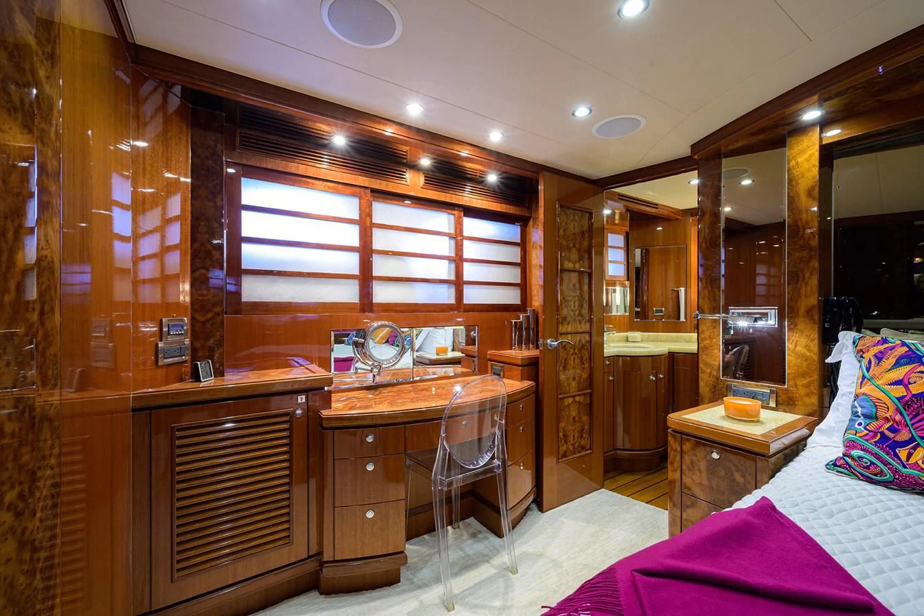 a bedroom with a bed and a desk aboard BARNSTAR Yacht for Sale